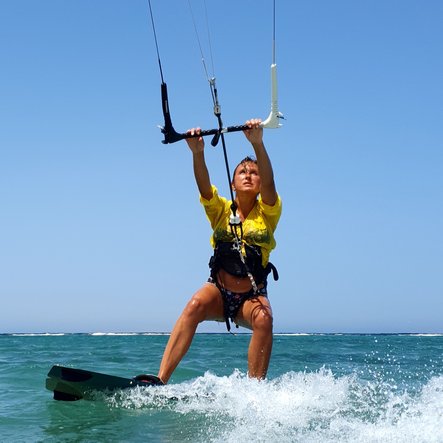 New born kitesurfer-girl making her first rides